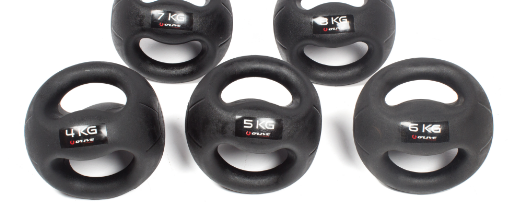 Verschiedene Medizinbälle mit Griff für Fitness, Training und Sport